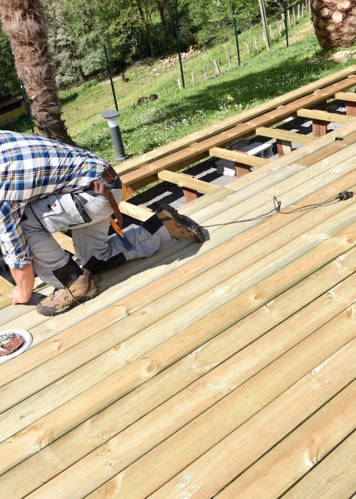 Carpenter building wooden deck Carpenter building wooden deck